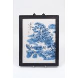 A modern Chinese blue and white porcelain plaque, of rectangular form, depicting a mountainous