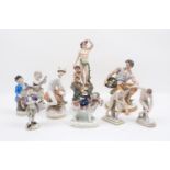 A collection of porcelain figure groups to include a Bacchus example, 29.5cm high, a Mercury by