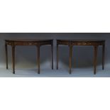 A pair of mahogany demi-line tables, 19th Century, the tops formerly D-ends to a dining table, the