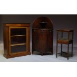 A Regency mahogany and inlaid corner washstand, of bowfront form, the raised back with small