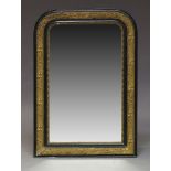 A French Art Nouveau ebonised and gilt wall mirror, early 20th Century, of arched form, with moulded