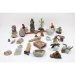 A large collection of soapstone and jade carvings, to include figural carvings of the Queen Mother