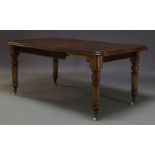 A Victorian mahogany extending dining table, the rounded rectangular top with one additional leaf