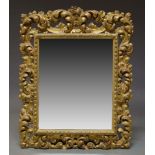 A Florentine style giltwood and gesso wall mirror, 19th Century, of rectangular form with pierced