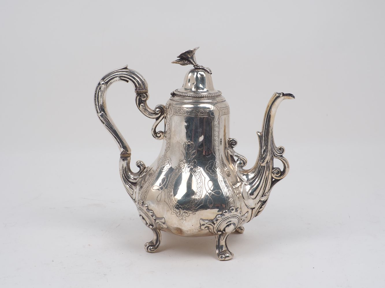 A nineteenth century French silver coffee pot by Martial Fray, Paris, c.1850, the lobed body