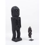 Two 19th century North African standing carved wood figures, 40.2cm and 17cm high, together with a