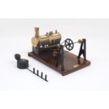 A model steam engine by Mersey Model Co. Ltd of Liverpool, of brass boiler with funnel, valve and