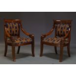 A pair of mahogany Empire style armchairs, late 20th Century, with upholstered back and seat, having