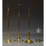 A brass three light standard lamp, on fluted column support to tripod base, 147cm high together with