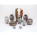 A collection of modern Asian ceramic wares, to include: a pair of Chinese figures, each modelled