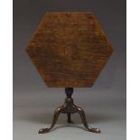 A George III style tilt top occasional table, 19th Century, the hexagonal top on turned baluster