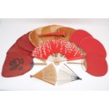 Nine Uchiwa fans, to include 3 graduated red fans of ovular form, the largest 29cm diameter, and 3