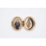 A late 19th/early 20th century ivory locket, of oval form, the plain body enclosing two glazed