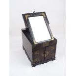 A Chinese brass mounted elm dressing box, 20th century, the cover lifting to form a standing mirror,