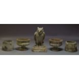 A composite stone owl garden statue, 20th Century, 69cm high, 43cm square, together with a pair of
