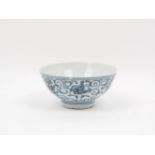 A small Chinese blue and white porcelain bowl, 19th century, decorated with scrolling patterns and