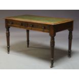 A Victorian oak library desk, the rounded rectangular top inset with green leather writing