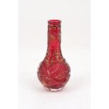 A Bohemian red lustre cut glass vase, late 19th century, of garlic bulb form decorated with