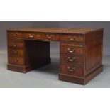 A George III style mahogany pedestal desk, late 20th Century, with brown leather inset writing
