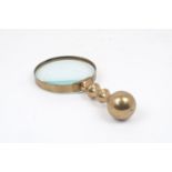 An early 20th century brass handled magnifying glass, 23cm longPlease refer to department for