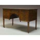 An Edwardian and later mahogany and floral marquetry knee hole desk by Edwards & Roberts, the