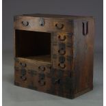 A small Japanese Tansu chest, late Edo Period, with open compartment and seven drawers and one