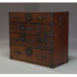 A Japanese stained wood tansu chest, late Edo period, with an arrangement of drawers and one