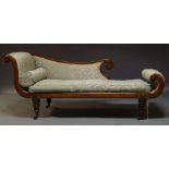 A Regency mahogany chaise longue, with scrolling ends and shaped backrest, upholstered in pale green