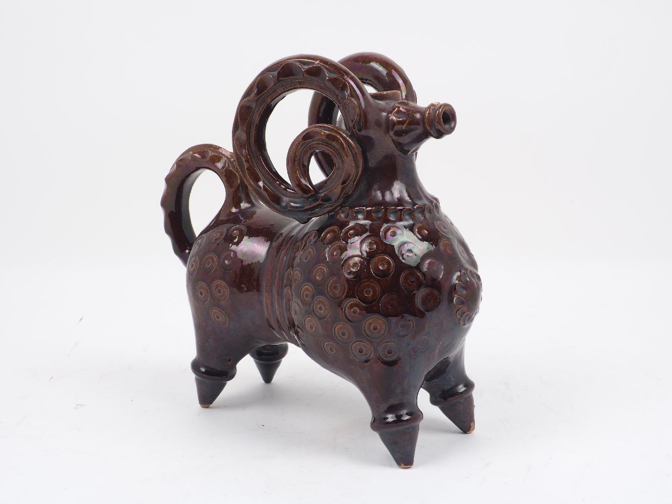 A Canakkale brown glazed pottery aquamaline, 19th/early 20th century, modelled as a ram, 21.5cm