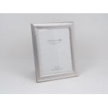 An Italian silver photo frame in presentation box, by Argento SC, of dimpled design with lacquered