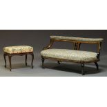 A Victorian walnut, ebonised and marquetry low settee, with floral upholstered top rail and seat,