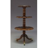 A George III mahogany dumb waiter, with three circular graduated tiers on turned column support to