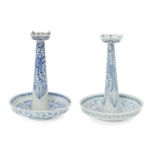 A pair of Chinese porcelain candlesticks, late 19th century, painted in underglaze blue with