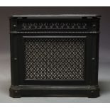 A Victorian cast iron and black painted radiator cover, with pierced top, sides and frieze, raised