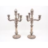 A pair of 19th century Italian silver candlesticks, each designed as four branches with fluted