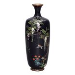 A Japanese cloisonné enamel vase, Meiji period, finely decorated with sparrow beneath wisteria,