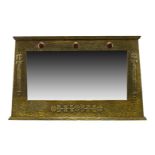 An Arts and Crafts brass framed over-mantel mirror with ceramic insets c.1905 The wood frame covered