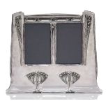 An Art Nouveau silvered pewter double photograph frame, probably German c.1900, stamped with