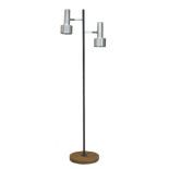 In the manner of Peter Nelson, a two light standard lamp c.1960 With two adjustable brushed steel
