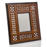 A Mashrabiya framed mirror, possibly retailed by Liberty and Co c.1900, unsigned A Moorish style