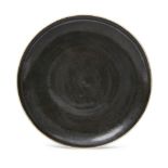 Lucie Rie (1902-1995) and Hans Coper (1920-1981), a manganese glazed plate c. 1960, both seals