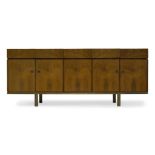 A rosewood sideboard, retailed by Heals c.1960 With five frieze drawers, two drawers including