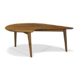 A teak boomerang coffee table c. 1950 The shaped top on splayed and tapering tripod legs 31cm