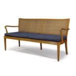 Frank Rudolf, a beech and caned bench attributed to Erwin Behr, Wendlingen c.1950 With caned