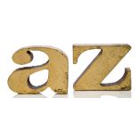 Curtis Jeré, 'a' and 'z' bookends Both signed and dated 1971 In cast iron with gold leaf finish Each