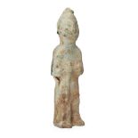 A Chinese pottery tomb figure, Han dynasty, modelled standing holding a rifle in front of his