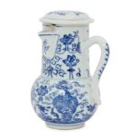A Chinese porcelain ewer and cover, Kangxi period, painted in underglaze blue with adjoining
