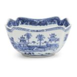 A Chinese export porcelain square bowl, 19th century, painted in underglaze blue with landscapes and