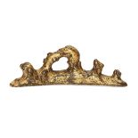 A Chinese gilt bronze brush rest, 18th century, cast as a dragon's head emerging from crashing