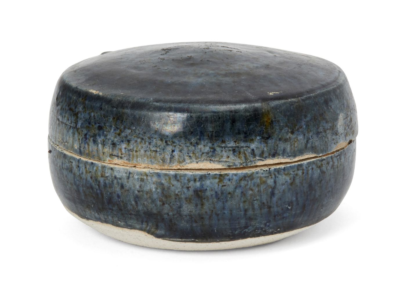 A Chinese blue-glazed pottery cosmetic box, Tang dynasty, of circular form, covered in a slightly